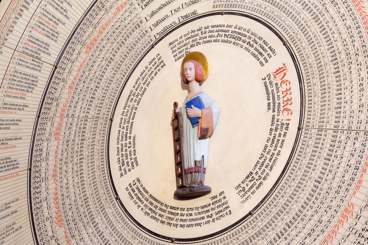 St. Lawrence on the calendar in Lund Cathedral / iStock/stigalenas The Saint standing in the center with a grill and a book in his hands
